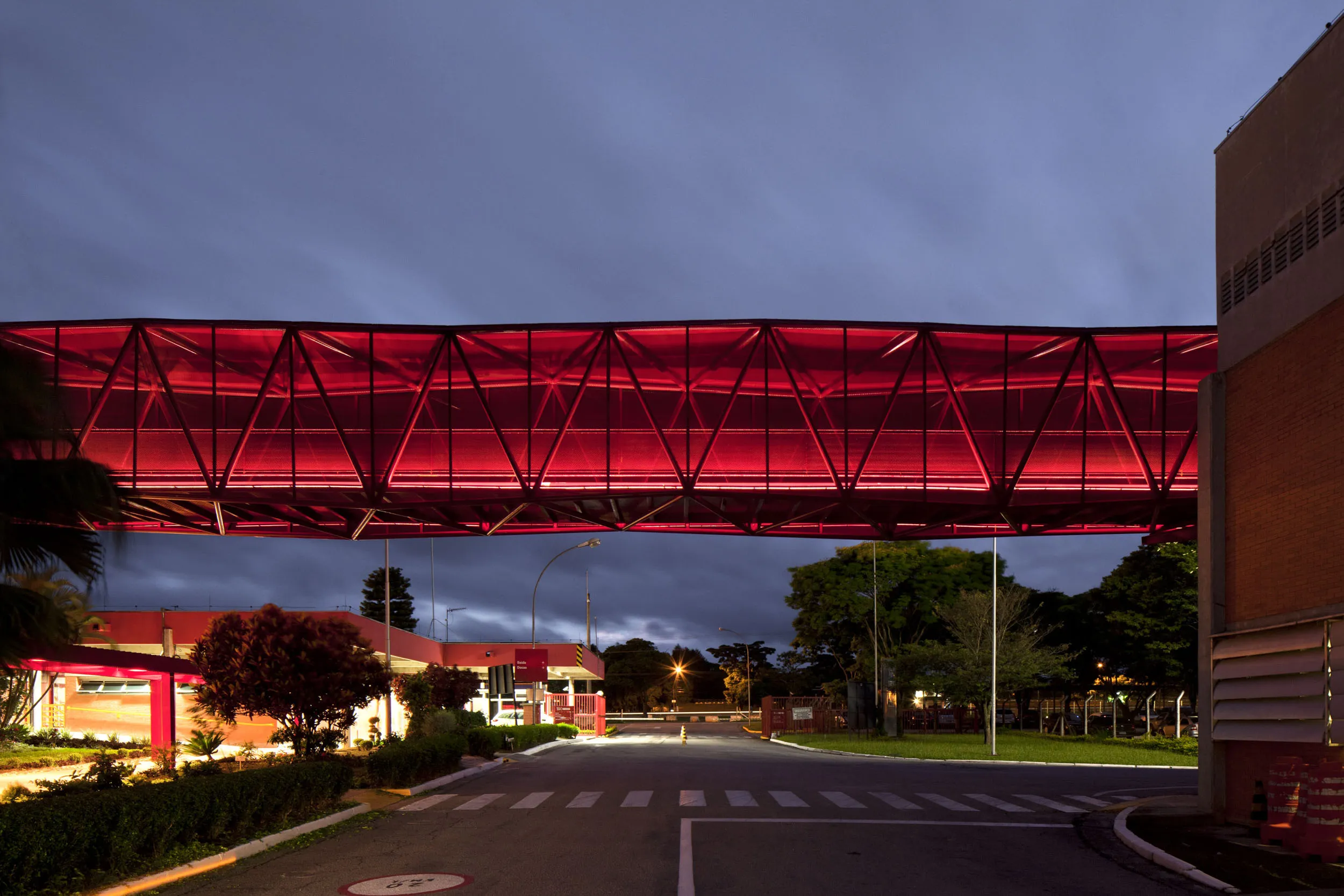 Night view of the first footbridge crossing the access street